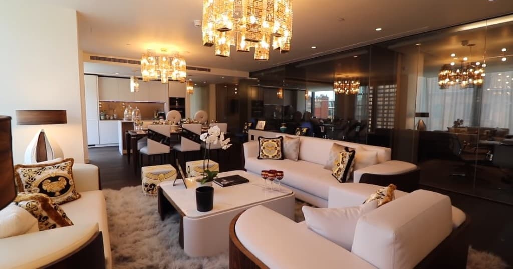 Luxury open-plan living and dining with chandeliers and refined finishes