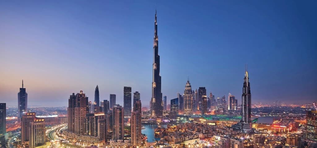 Dubai skyline at twilight with Burj Khalifa and city lights